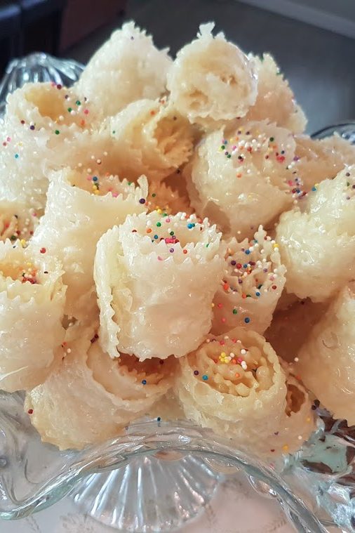 Moroccan pastries with colourful sprinkles in a glass dish